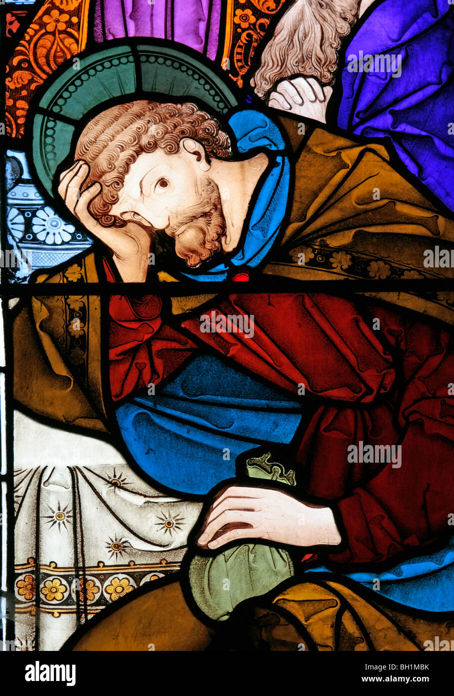 A stained glass window depicting Judas Iscariot at the Last Supper, All Saints Church, Allesley, Coventry Stock Photo