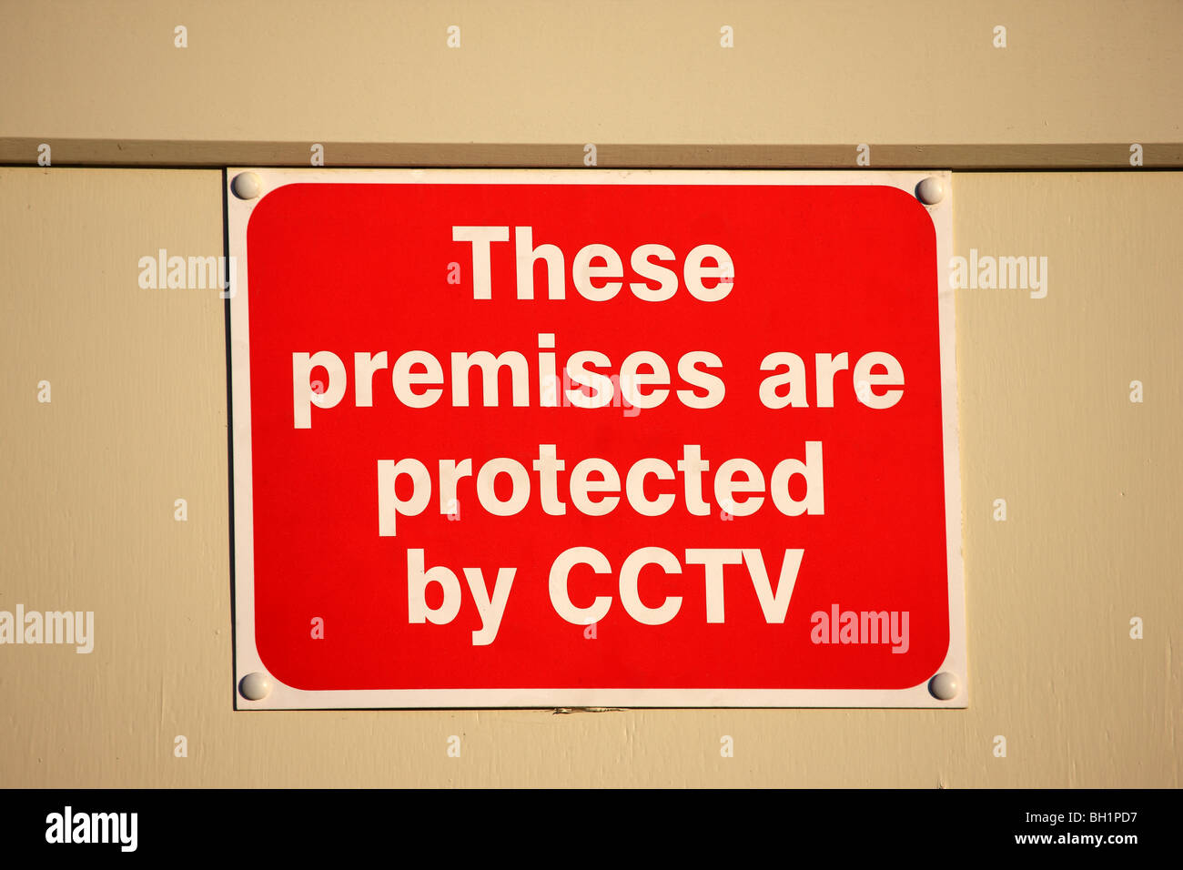 CCTV notice stating that the premises are protected Stock Photo