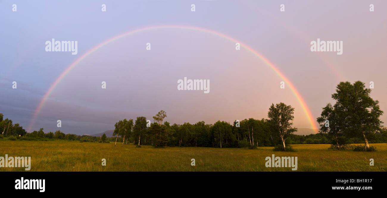 Rainbow over Alpine Upland, Upper Bavaria, Germany Stock Photo