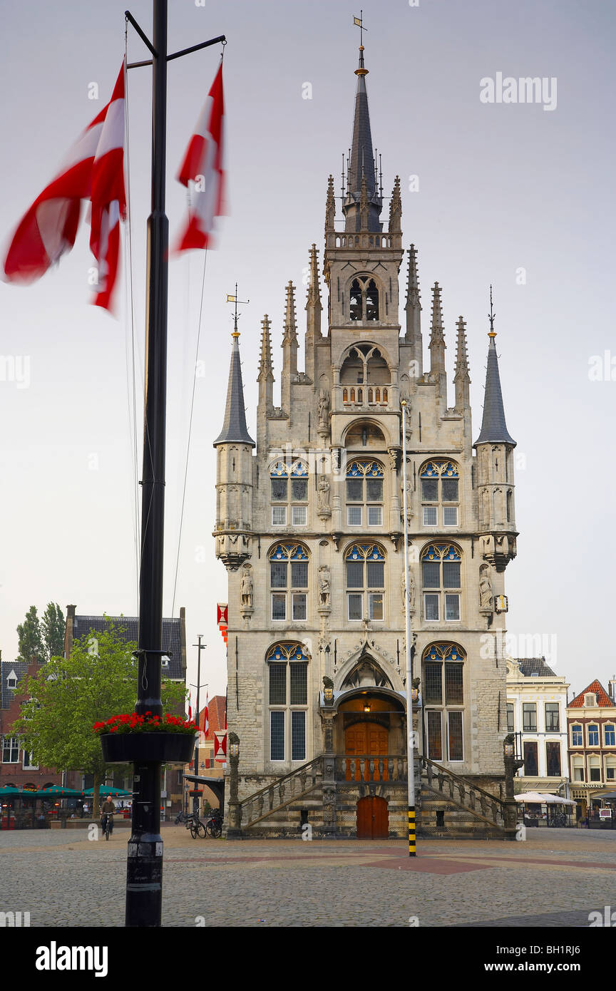 Flags in front of the gothic town hall at the market place at the Old Town, Gouda, Netherlands, Europe Stock Photo