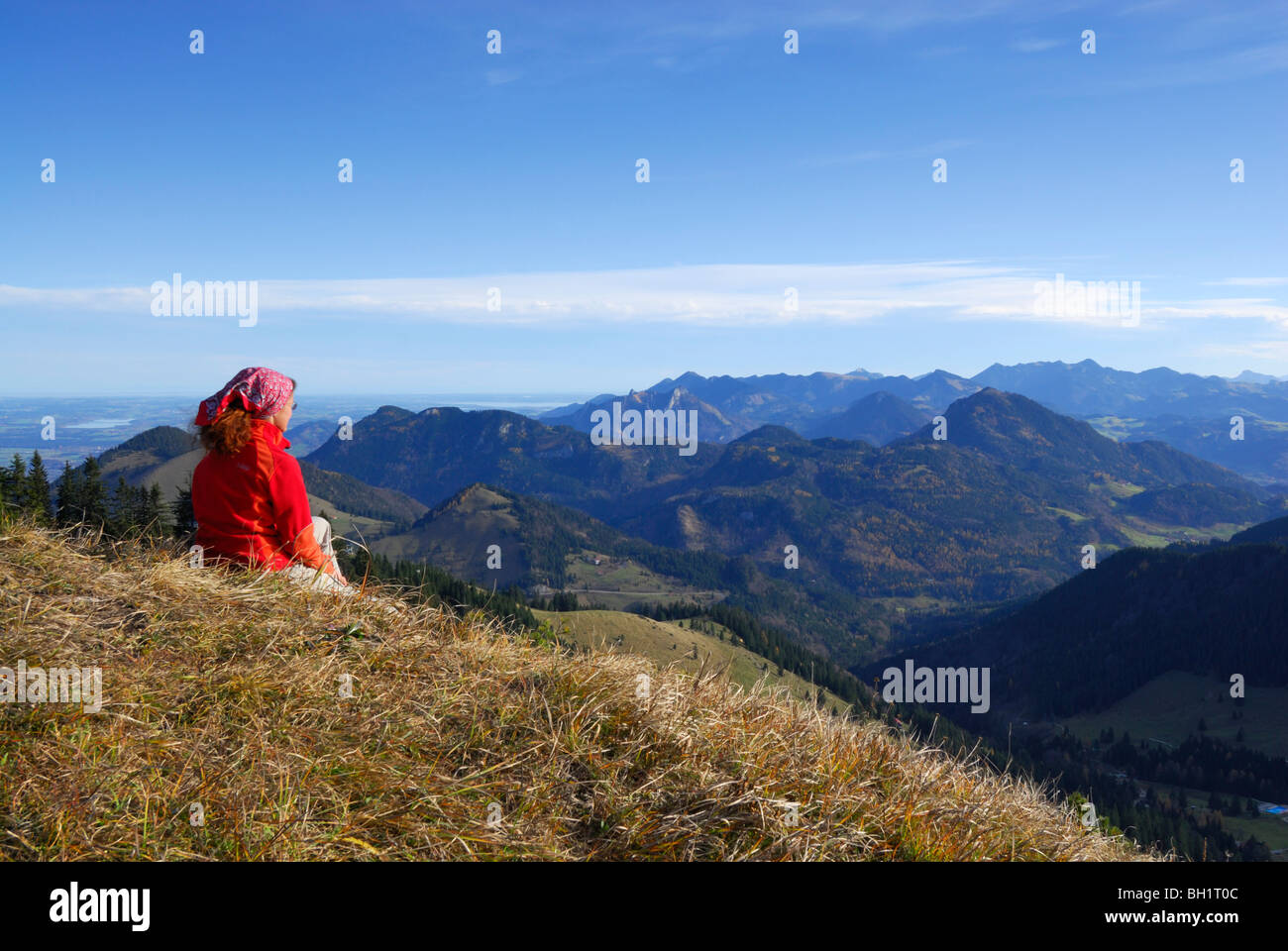 Woman enjoying view from Kleiner Traithen, Bavarian foothills, Bavaria, Germany Stock Photo