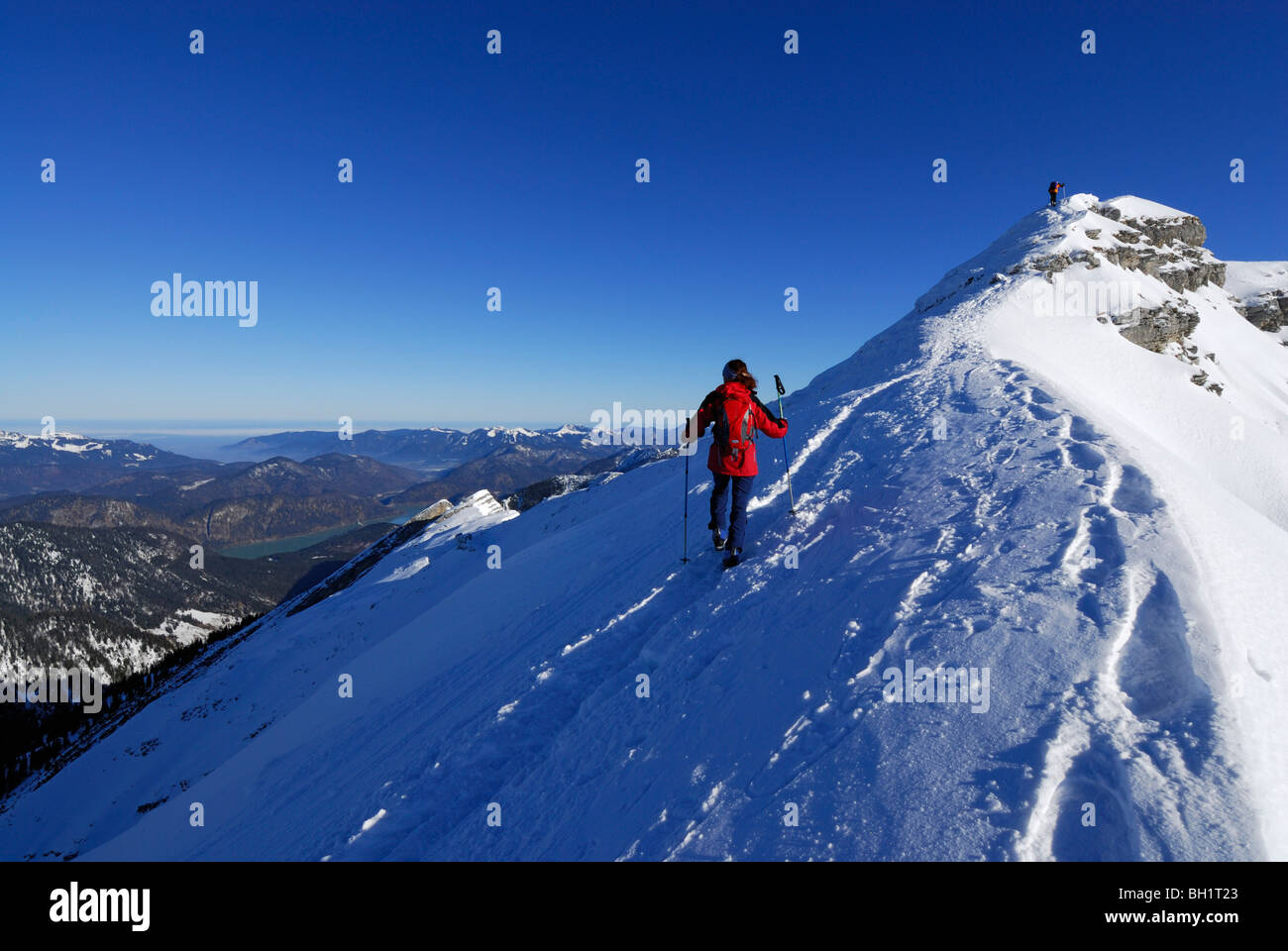 Woman ascending to summit of Schafreuter, Karwendel range, Tyrol, Austria Stock Photo