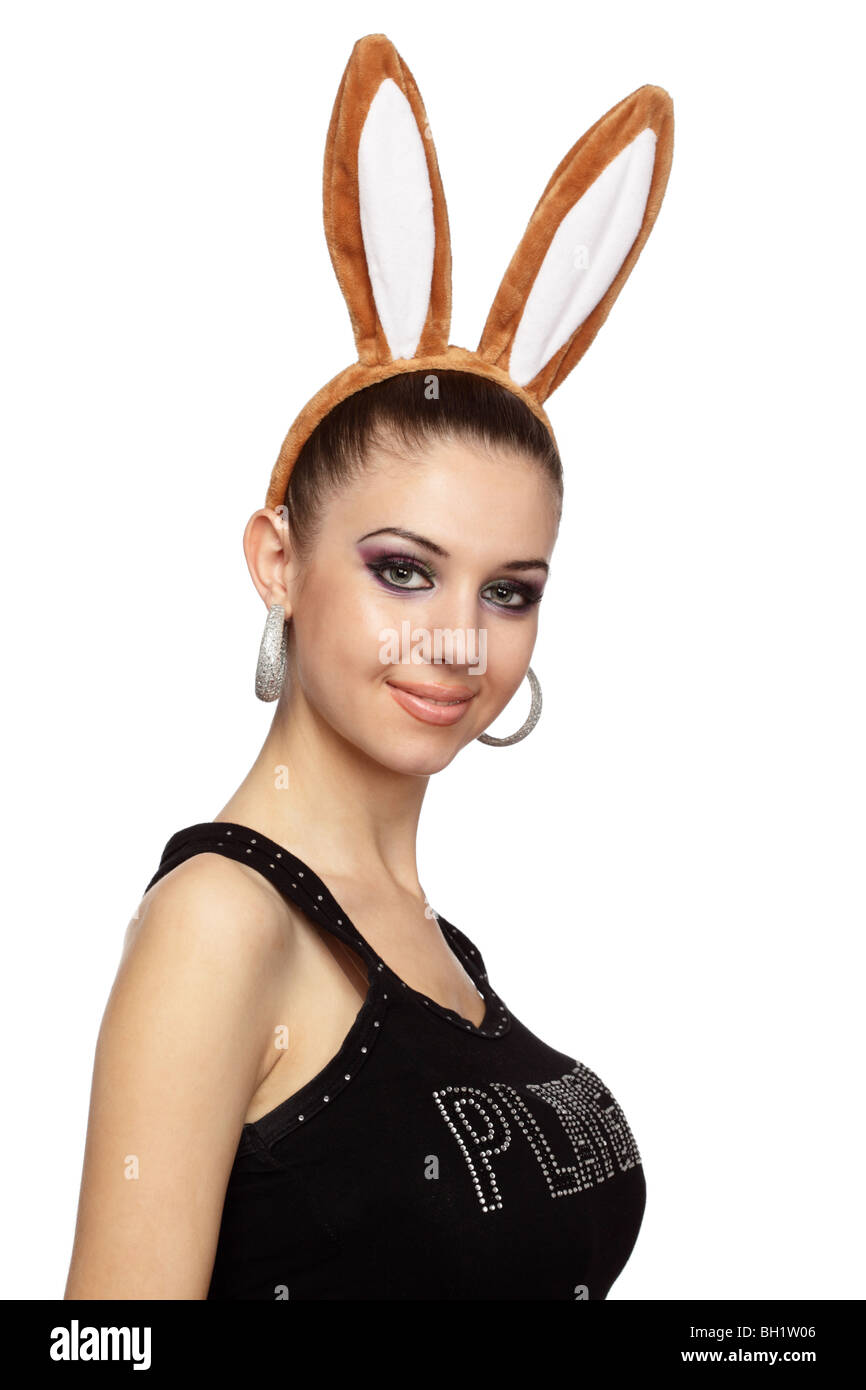 Attractive woman with bunny ears over white Stock Photo