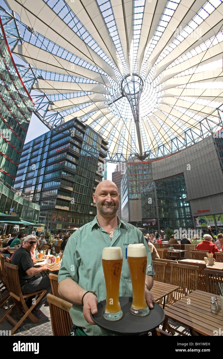 Café Sony Center, waiter with glasses of beer, Berlin, Germany Stock Photo