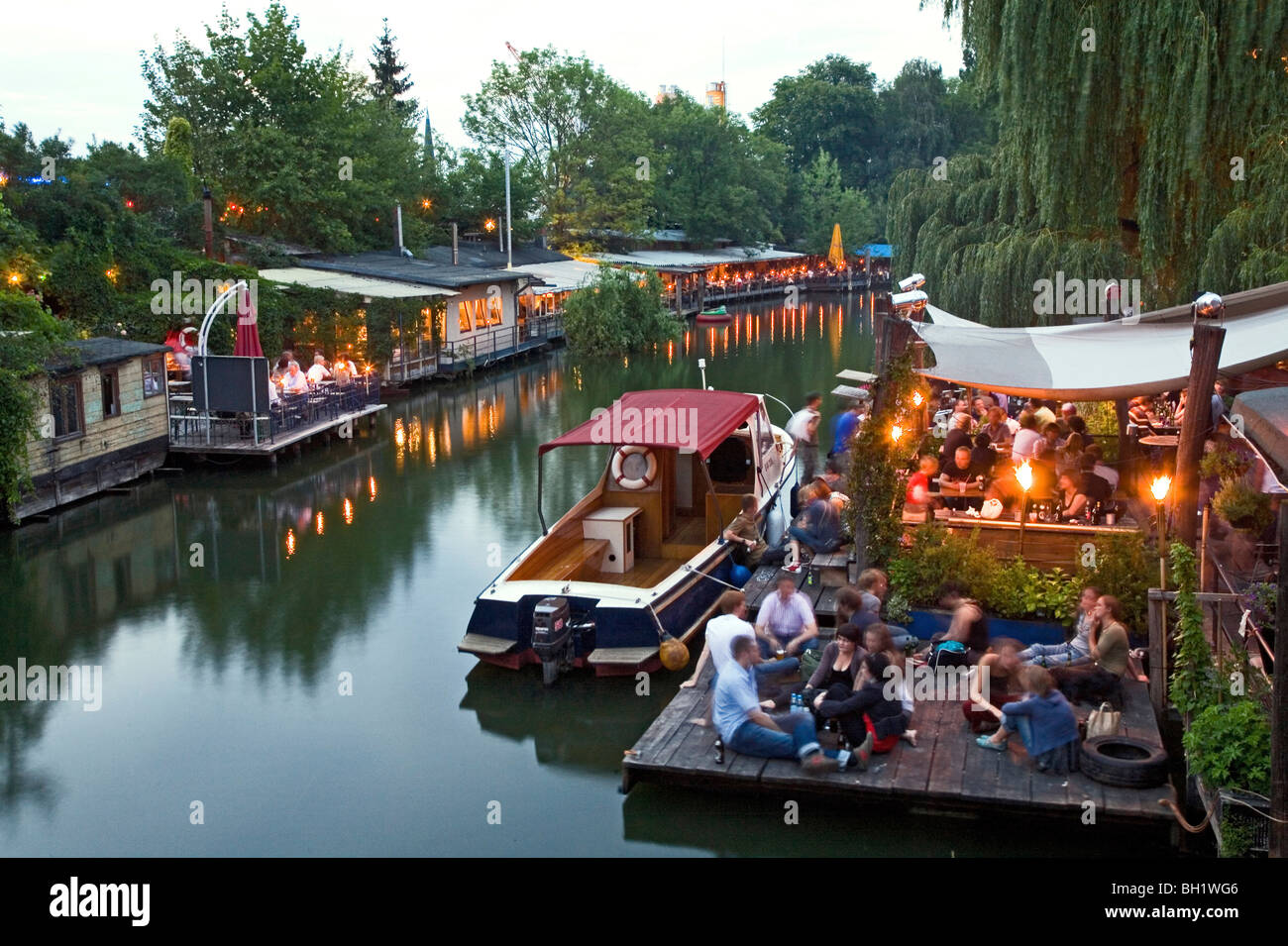Club der Visionaere, restaurants, cafés, bars at Flutgraben in the evening, canal, Treptow, Berlin, Germany Stock Photo
