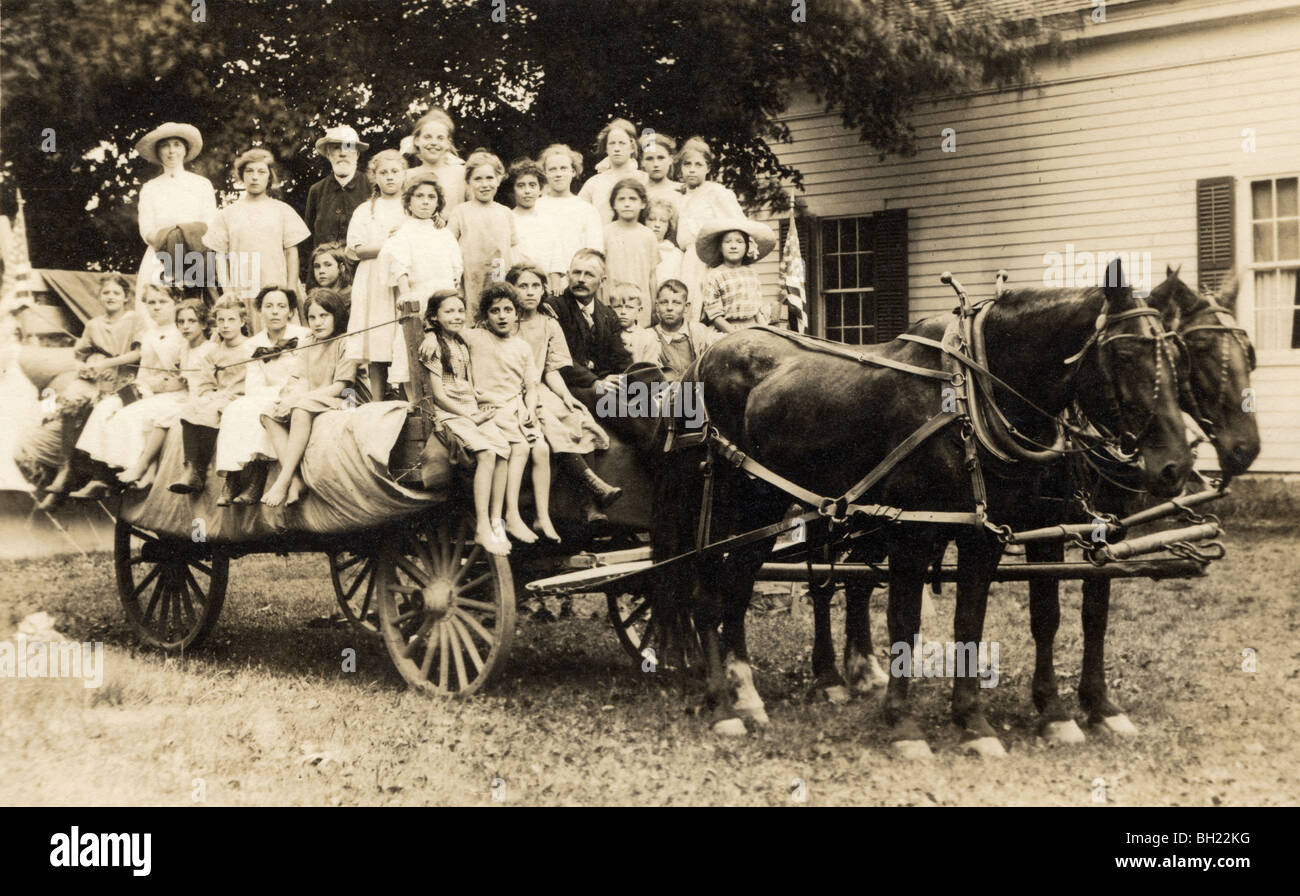 Large Group Riding On Horse Drawn Hay Wagon Stock Photo Alamy