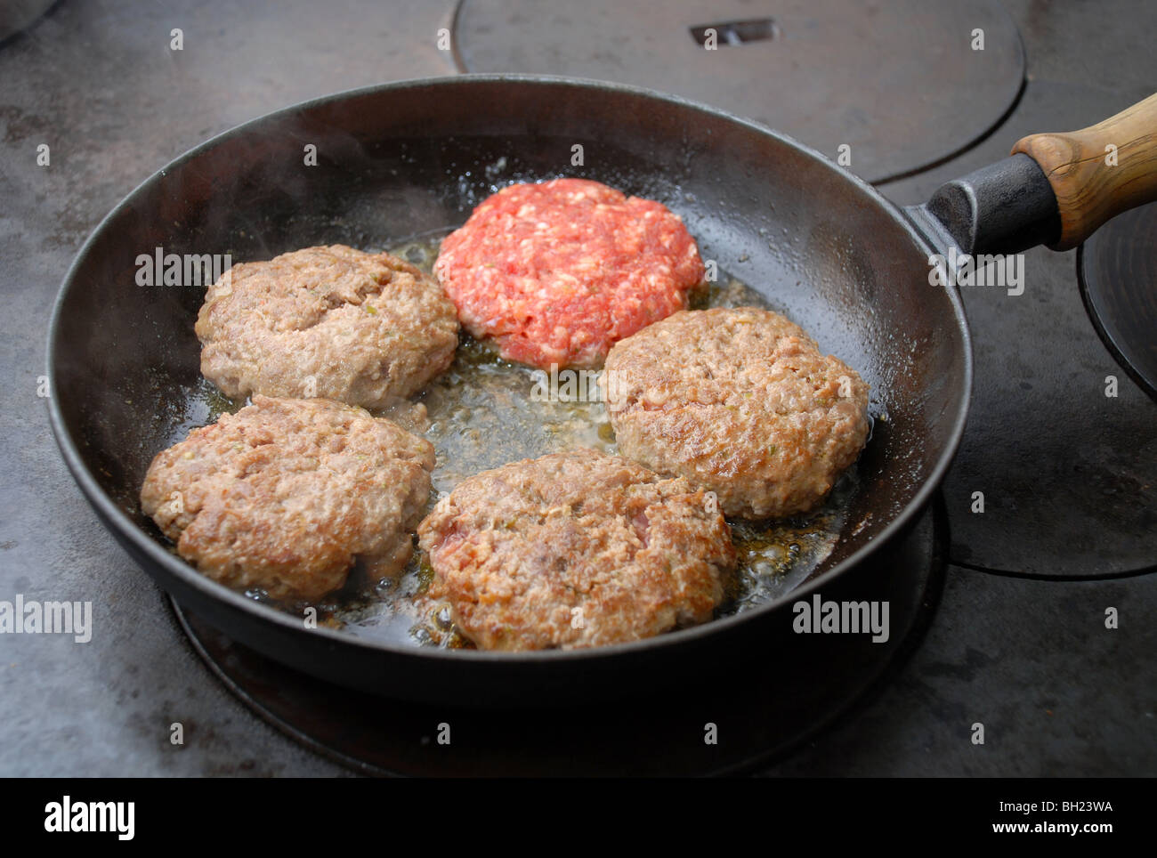 Frying hamburgers Stock Photo