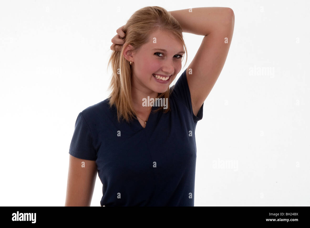 Pretty teen blonde girl smiling at camera Stock Photo - Alamy