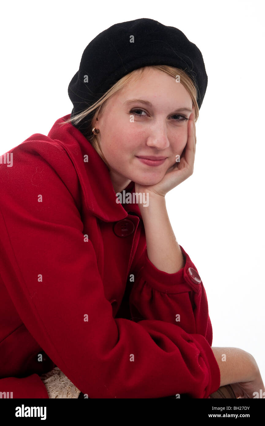 Teenage girl smiling in red coat and black beret Stock Photo Alamy