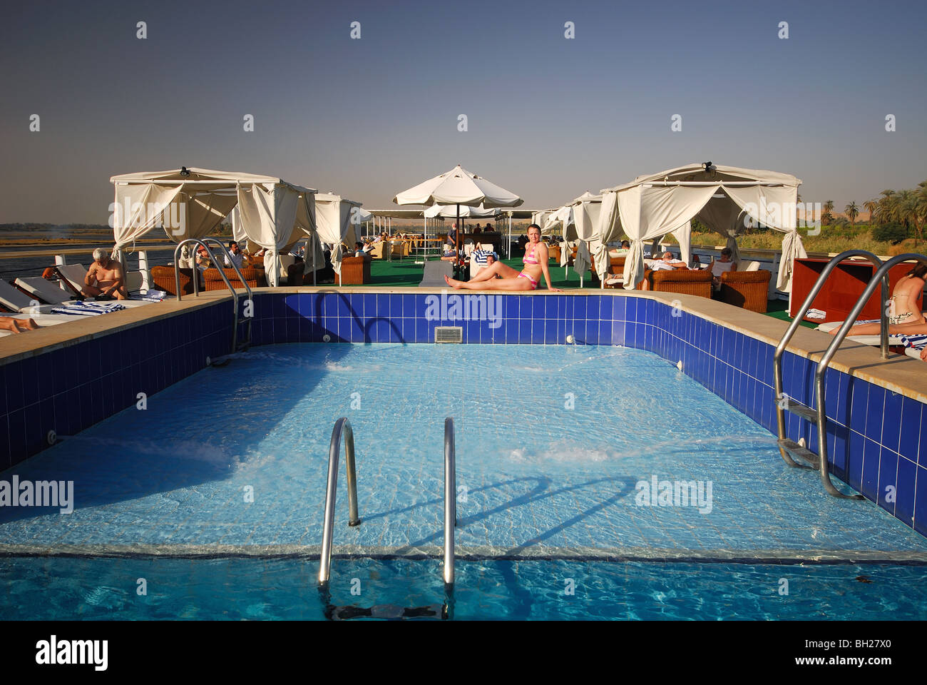 RIVER NILE, UPPER EGYPT. Swimming pool on a Nile cruise boat Stock