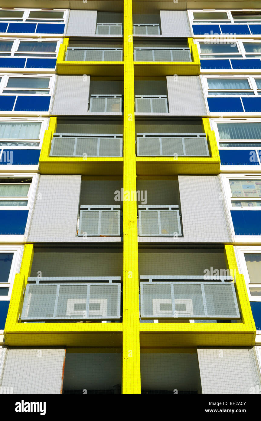 Bright abstract pattern formed by the new paint scheme on a block of old council flats on an estate in Redcliffe, Bristol. Stock Photo