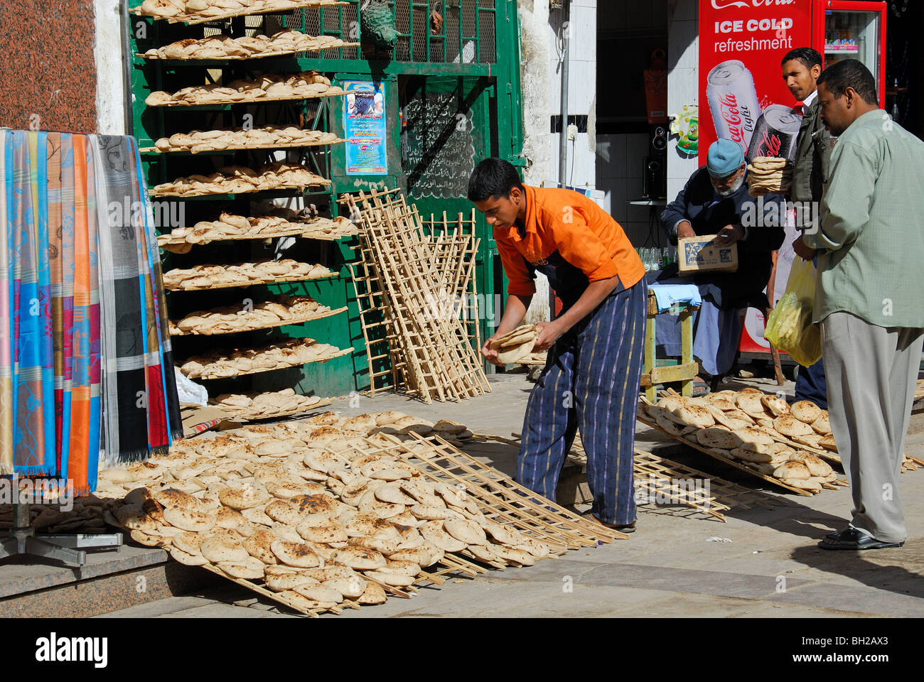 ASWAN, EGYPT. A bakery selling flatbread ('aish shamsi) in Aswan market. 2009. Stock Photo