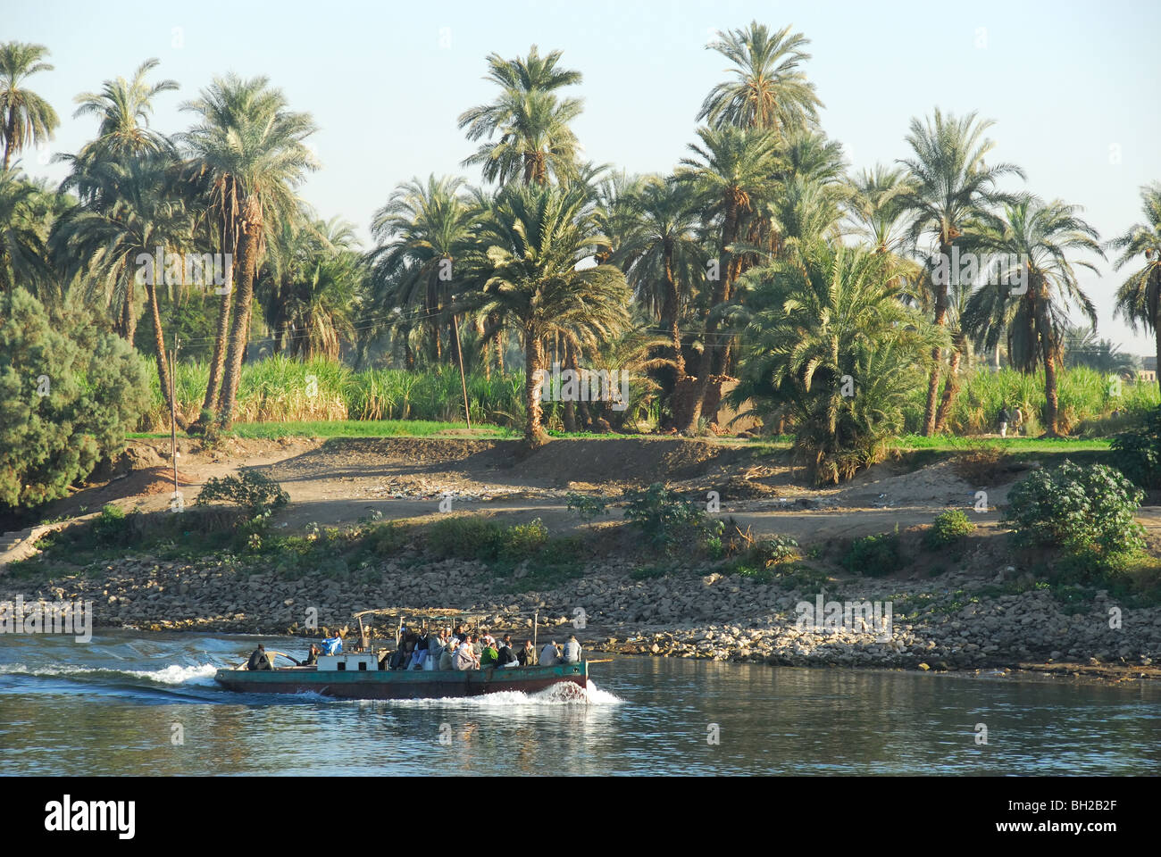 RIVER NILE, UPPER EGYPT. A small boat carrying local people along the ...