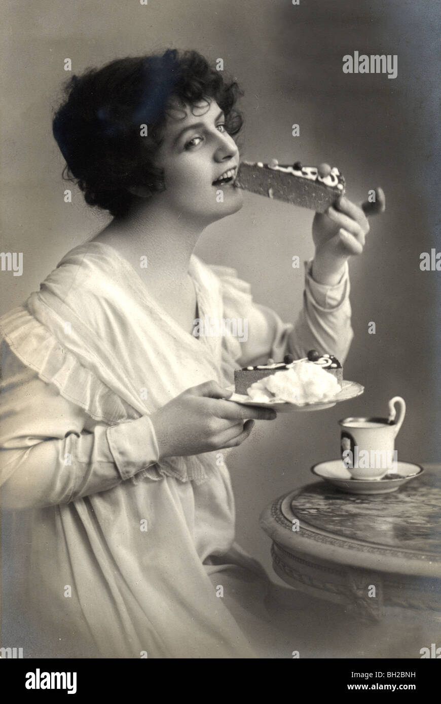 Beautiful Woman Eating Cheesecake Dessert Stock Photo