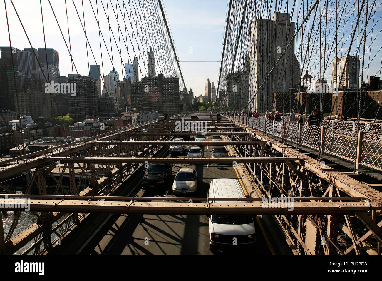 View of the Brooklyn Bridge Night and Days where people walk or ride across the East river to Manhattan Stock Photo