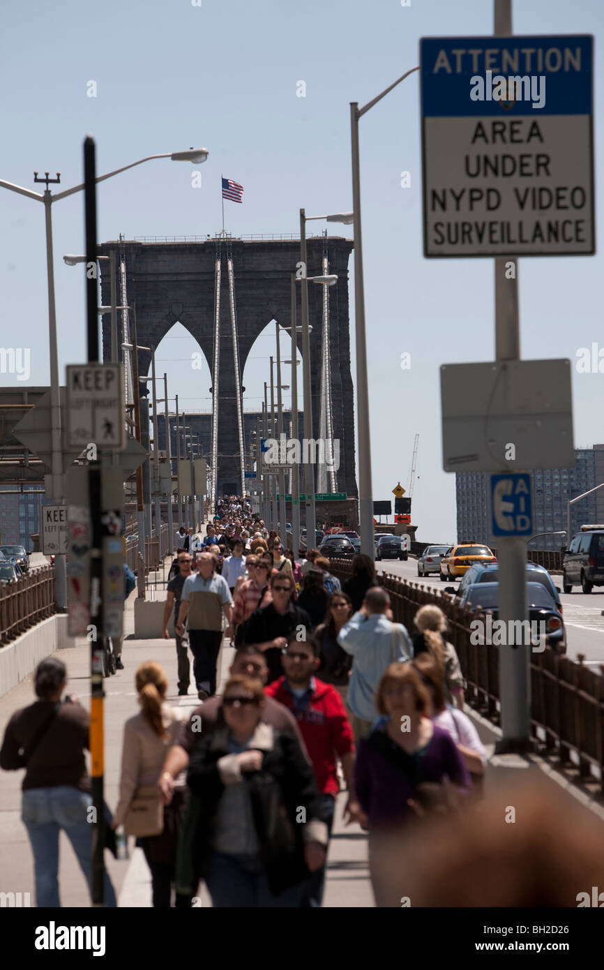 View of the Brooklyn Bridge Night and Days where people walk or ride across the East river to Manhattan Stock Photo