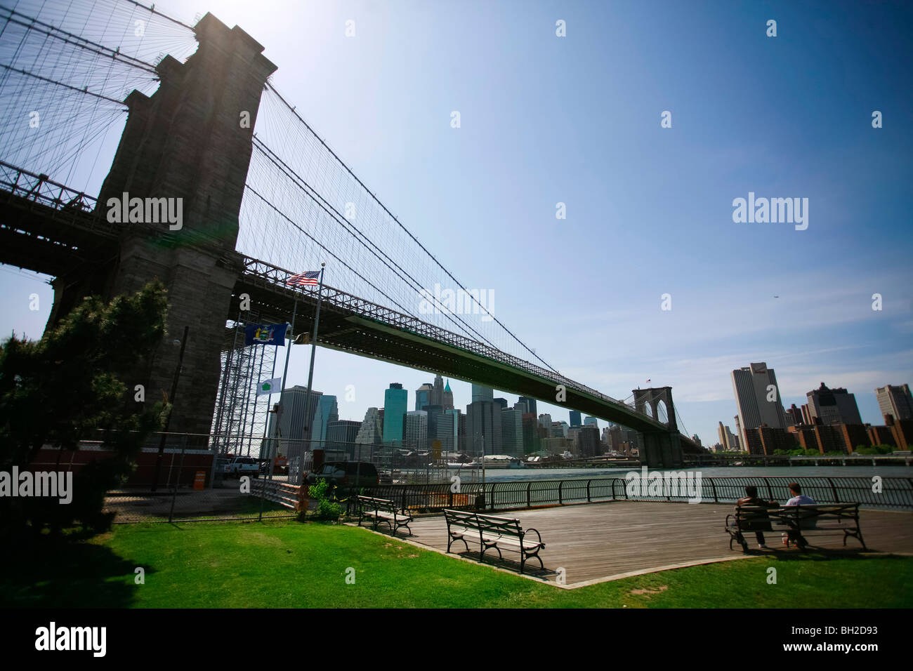 View of the Brooklyn Bridge Night and Days where people walk or ride across the East river to Manhattan Stock Photo