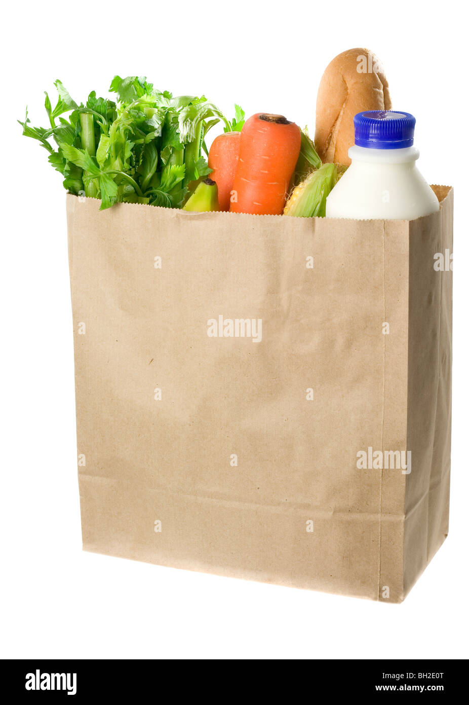 Paper bag full of groceries isolated on white background Stock Photo
