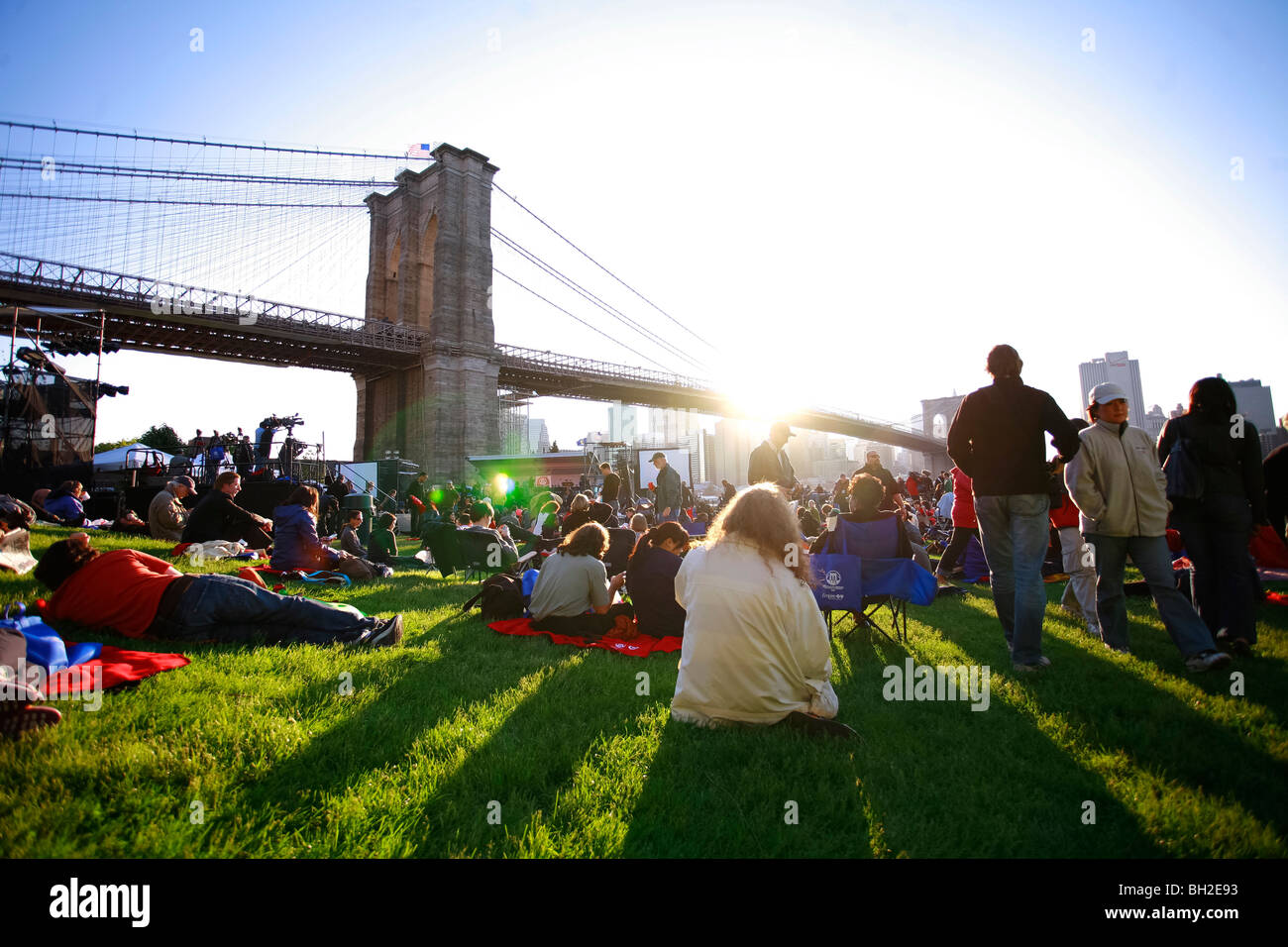 View of the Brooklyn Bridge Night and Days where people walk or ride across the East river to Manhattan Stock Photo