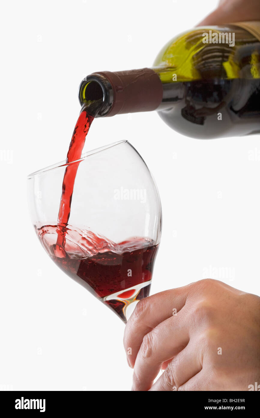 Red Wine pouring into glass Stock Photo Alamy