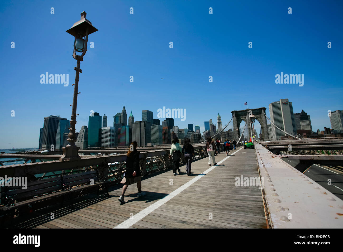 View of the Brooklyn Bridge Night and Days where people walk or ride across the East river to Manhattan Stock Photo