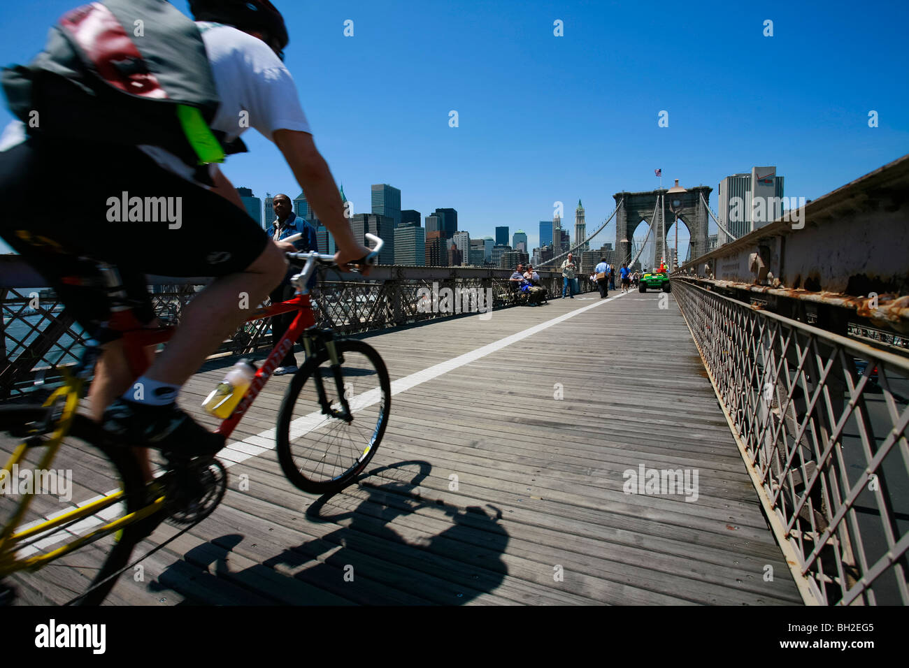 View of the Brooklyn Bridge Night and Days where people walk or ride across the East river to Manhattan Stock Photo