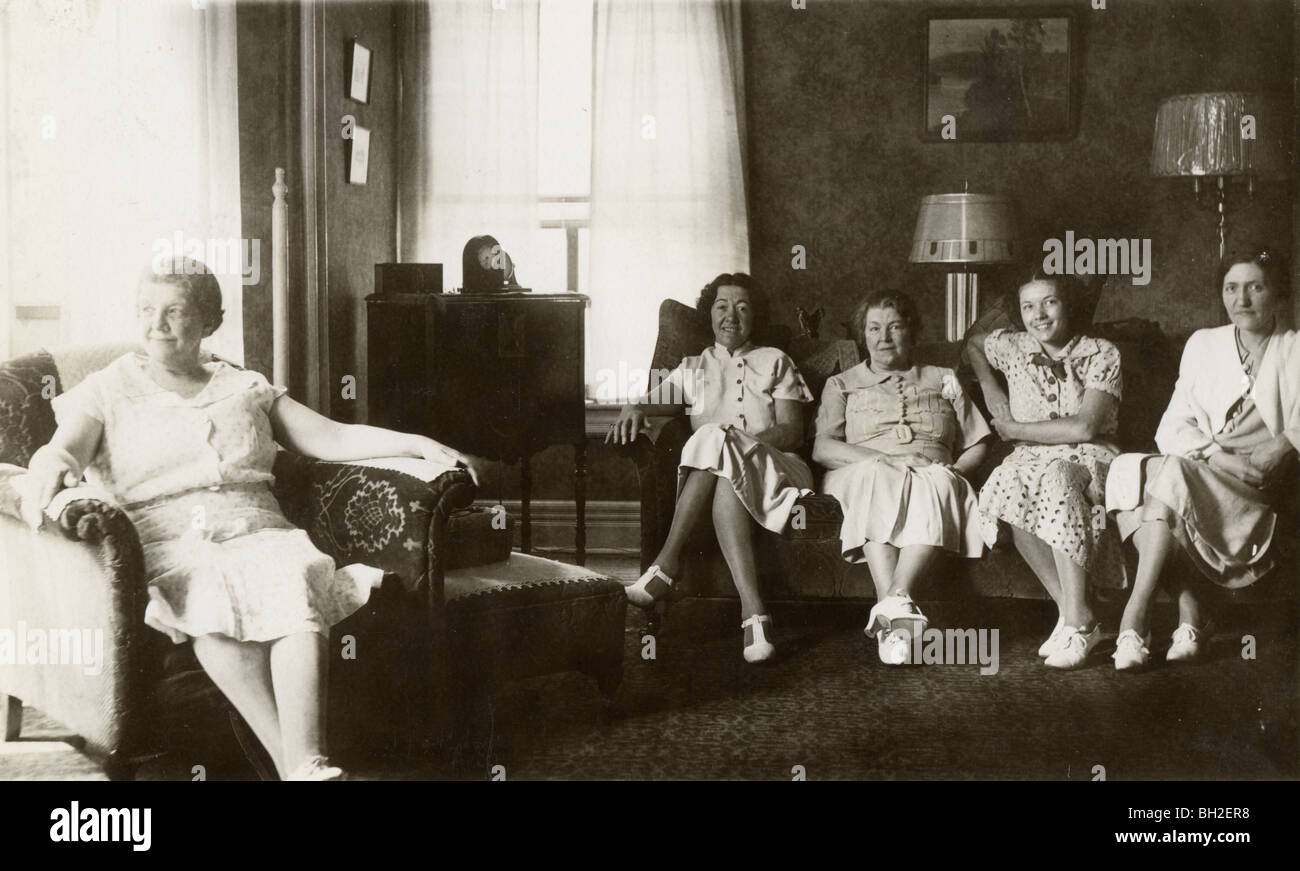 Five Women in Living Room in Odd Tableau Stock Photo