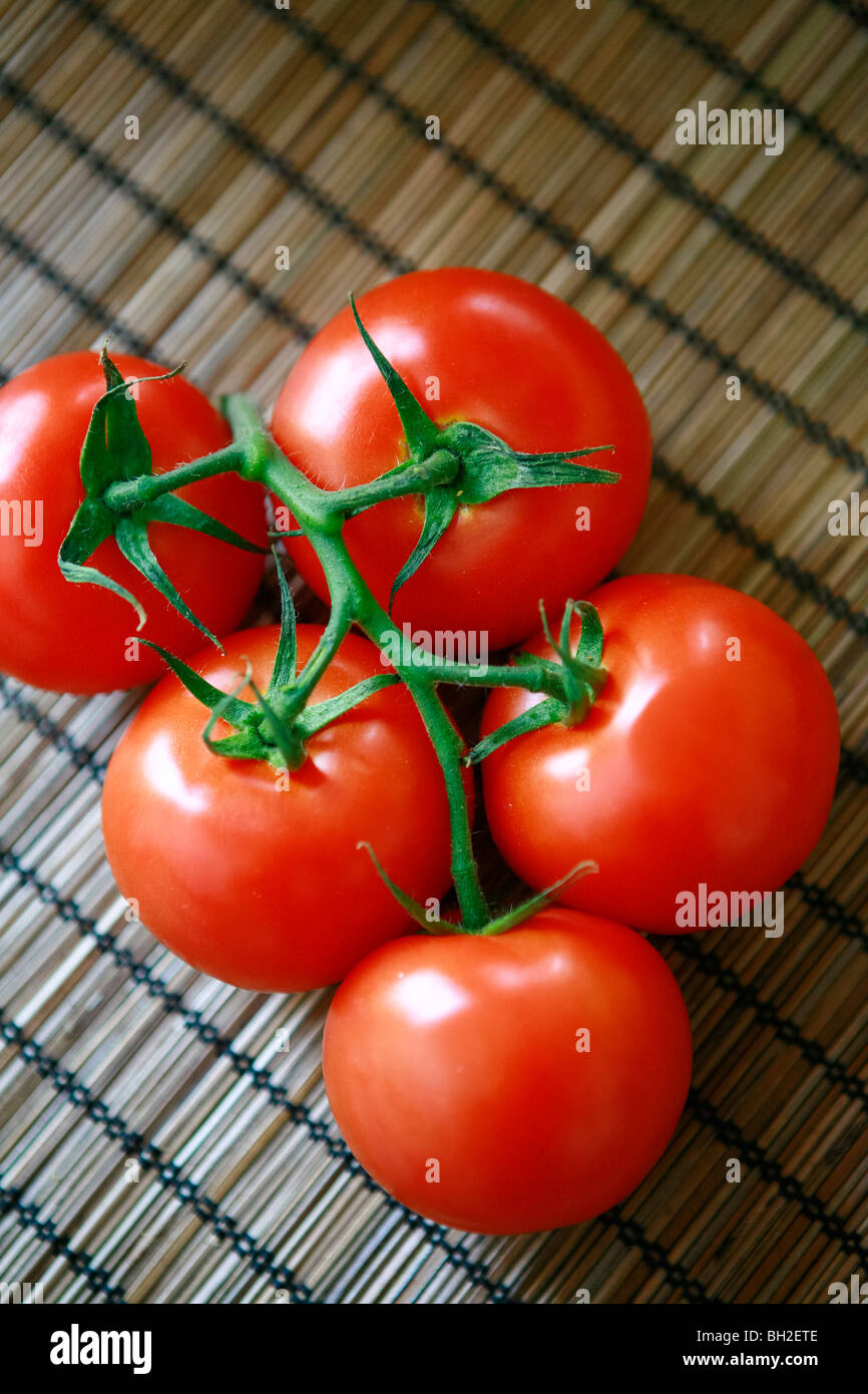 Fresh cut italian tomatoes on a table Stock Photo