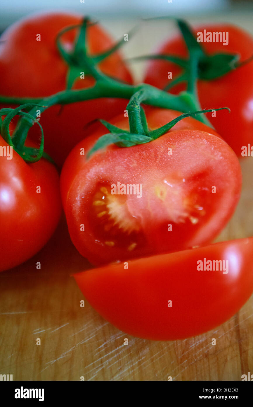 Fresh cut italian tomatoes on a table Stock Photo