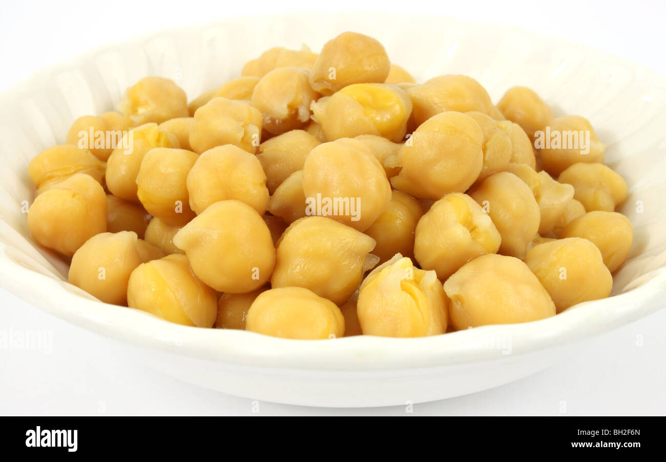 Garbanzo beans in bowl Stock Photo