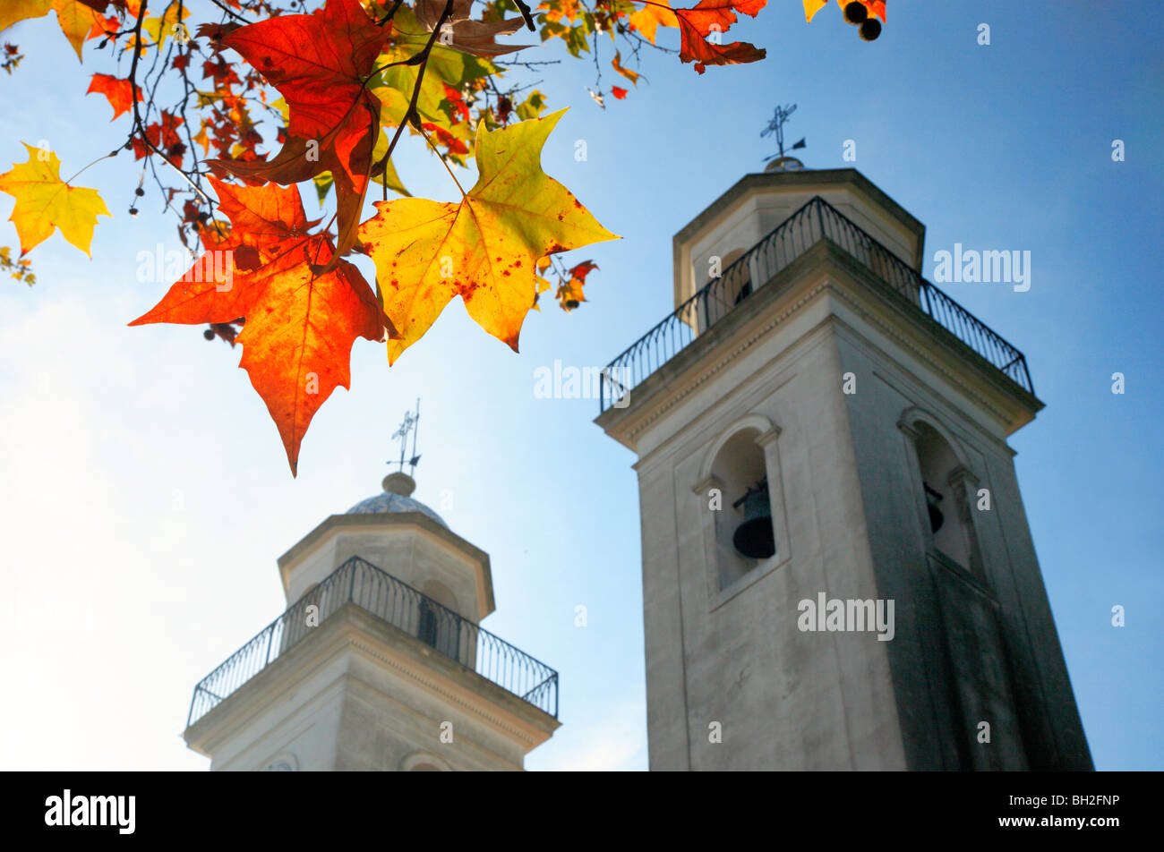 Colonia del sacramento basilica, with maple trees leaves at fall. Uruguay, south america. Stock Photo
