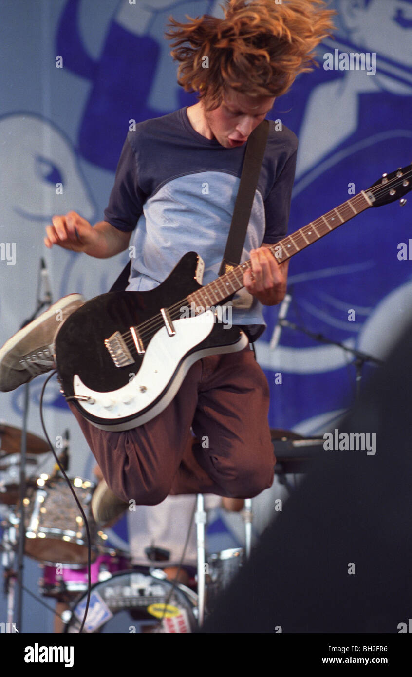 Beck performs during Lollapalooza at Deer Creek in Indiana. color vertical jumping guitarist singer songwriter Stock Photo