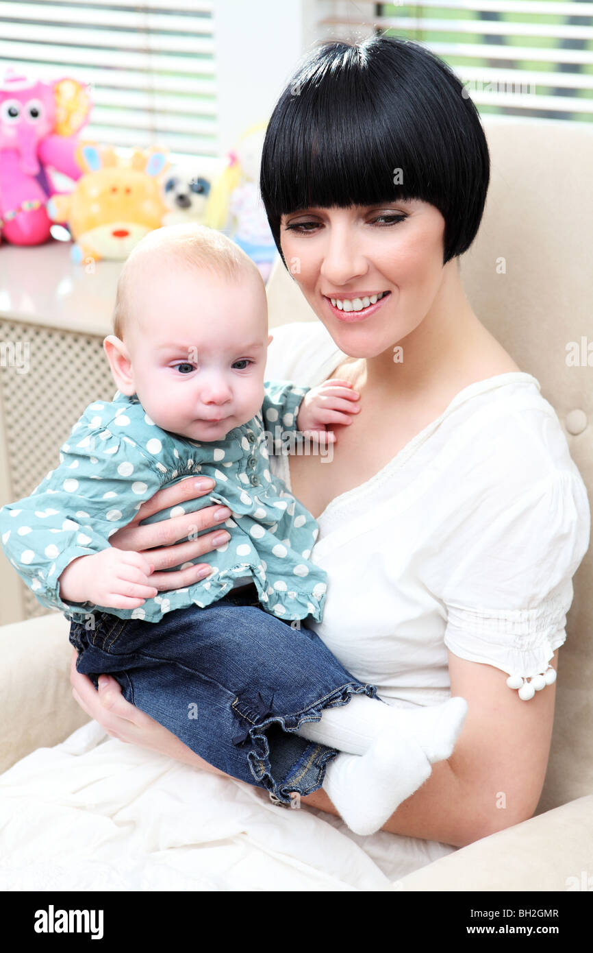 Mother and baby portrait. A commercial lifestyle image of a young mum and her baby daughter. Stock Photo