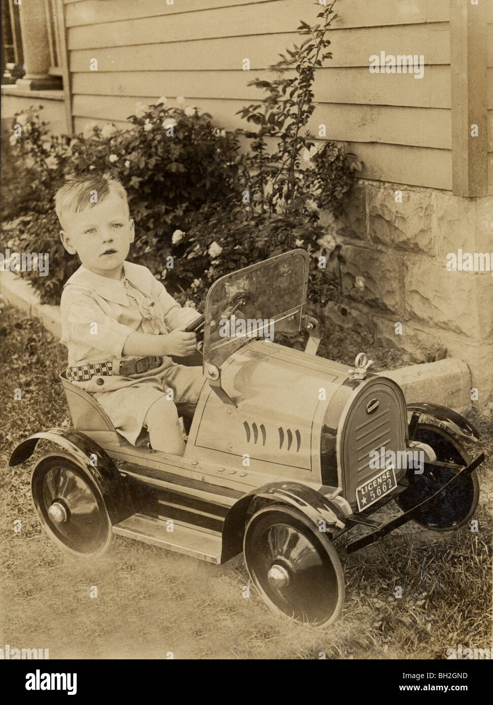 Little Boy Driving Hupmobile Pedal Car Stock Photo