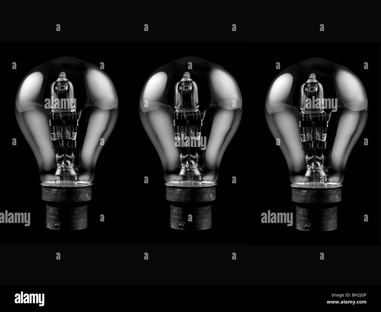 An incandescent light globe isolated against a black background Stock Photo Alamy