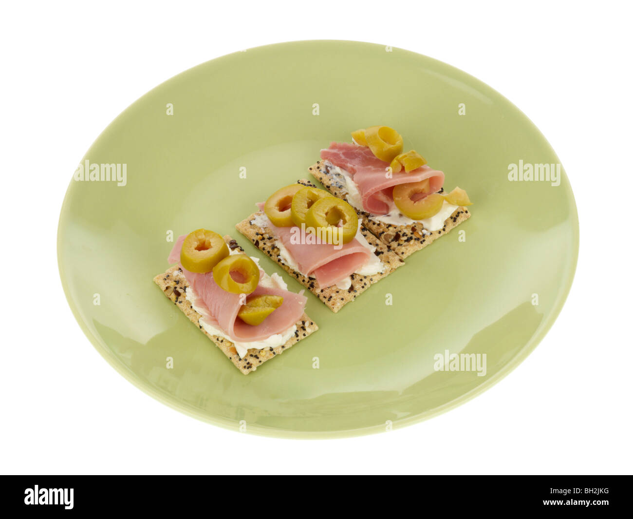 Multigrain Crackers with Ham and Olives Stock Photo