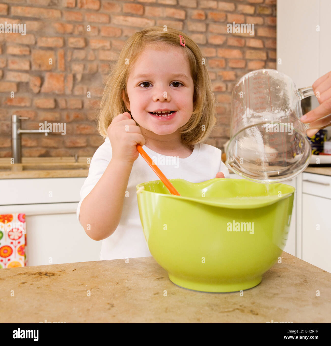 girl mixing ingredients in bowl Stock Photo Alamy
