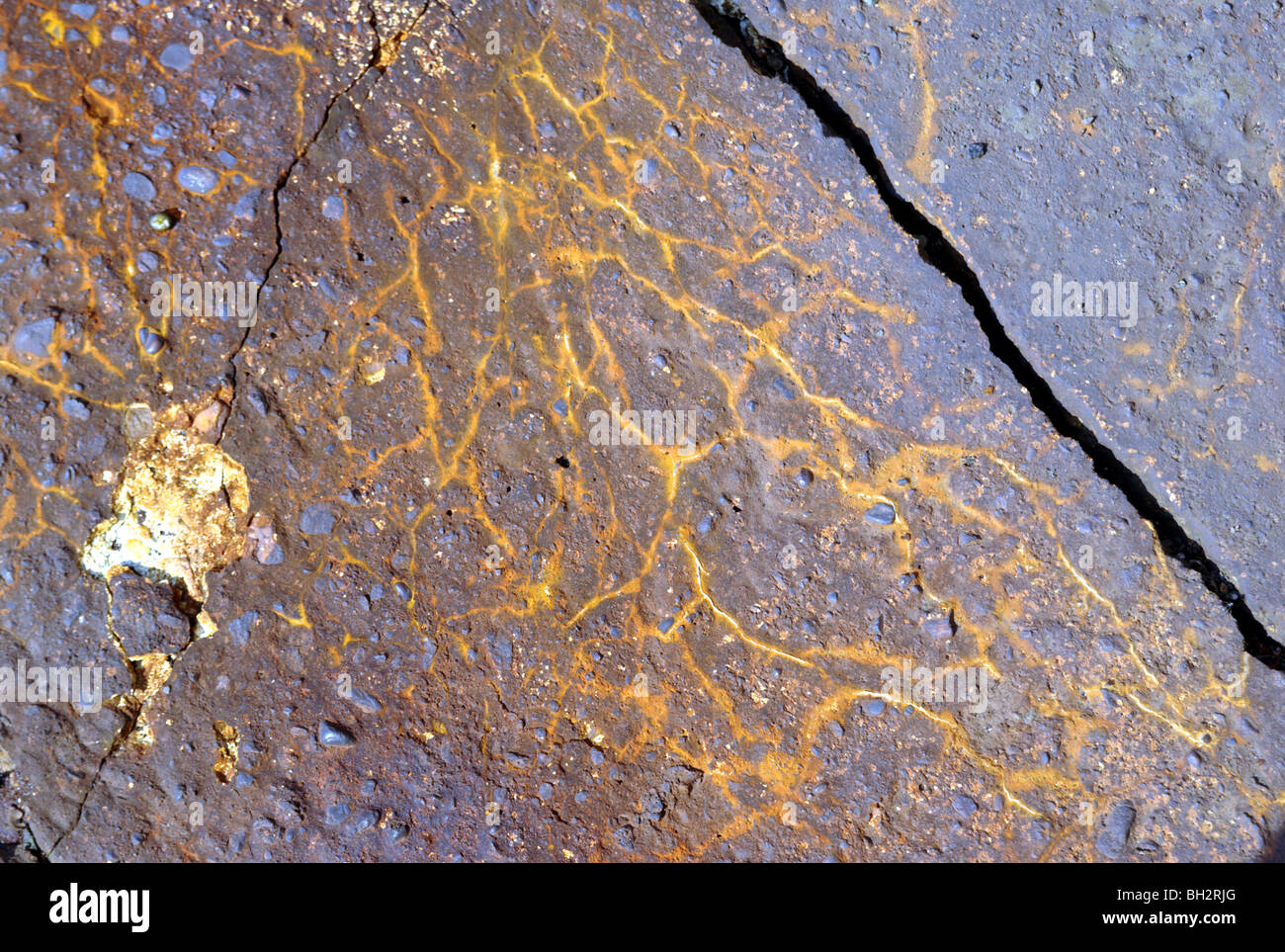 Corrosion marks on asphalt Stock Photo