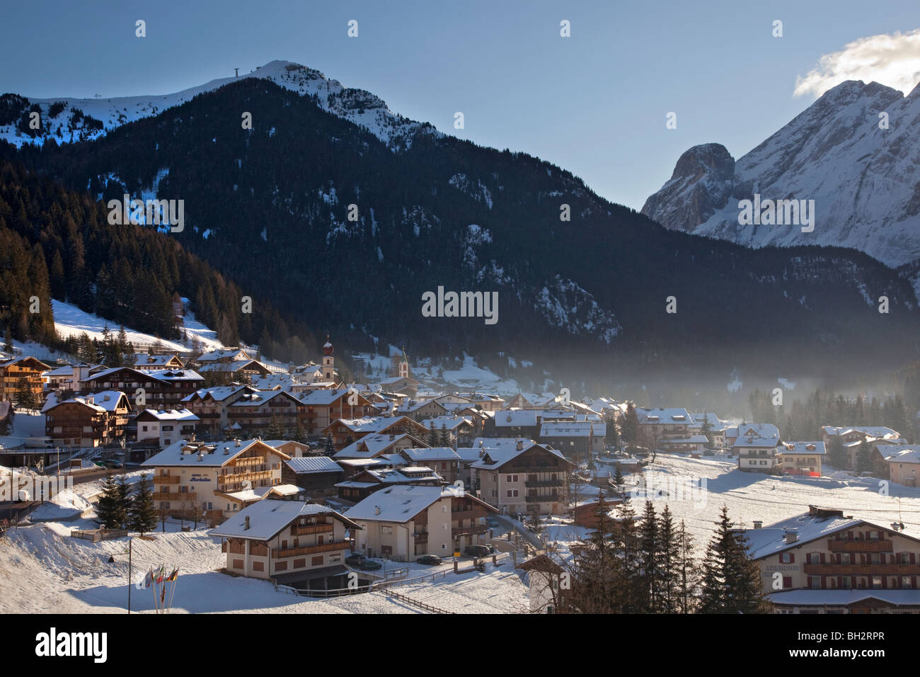 Village of Canazei in winter snow, The Dolomites, Val Di Fassa, Italy, Europe Stock Photo