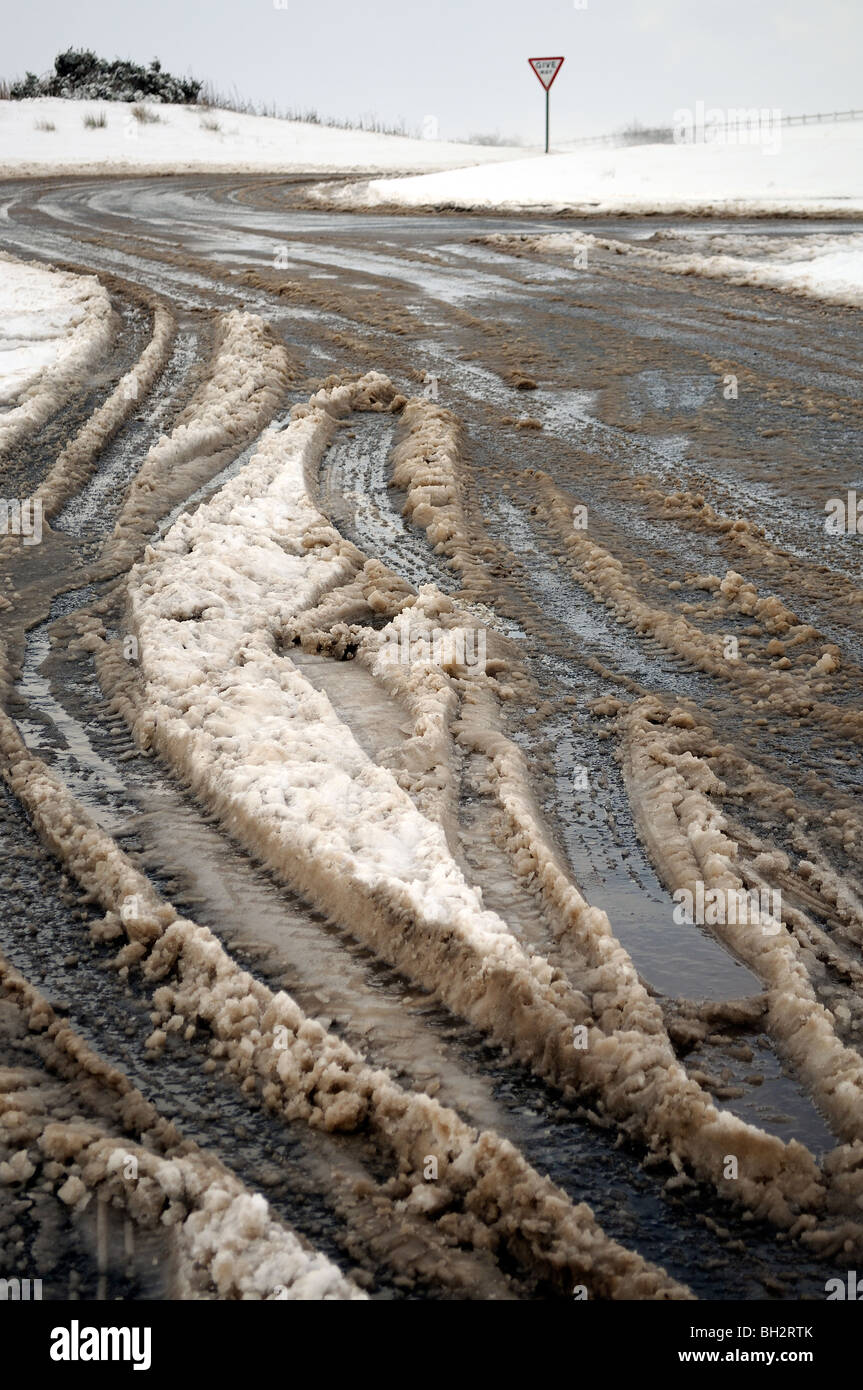 slush on road from melting snow, uk Stock Photo Alamy