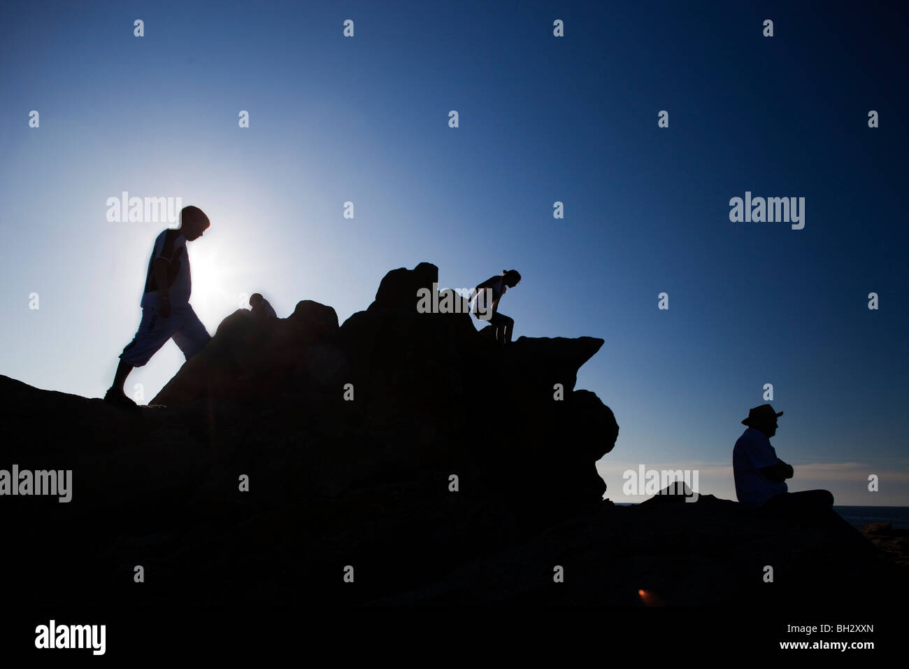People on the top of a cliff, Cote Sauvage (Wild Coast), Quiberon, departament de Morbihan, Brittany, France Stock Photo
