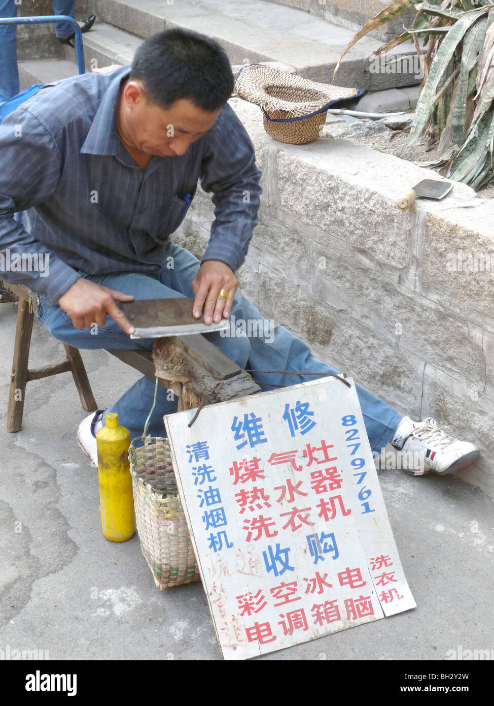 CHINA Migrant worker self-employed in Xiamen in Fujian province Photo by Julio Etchart Stock Photo