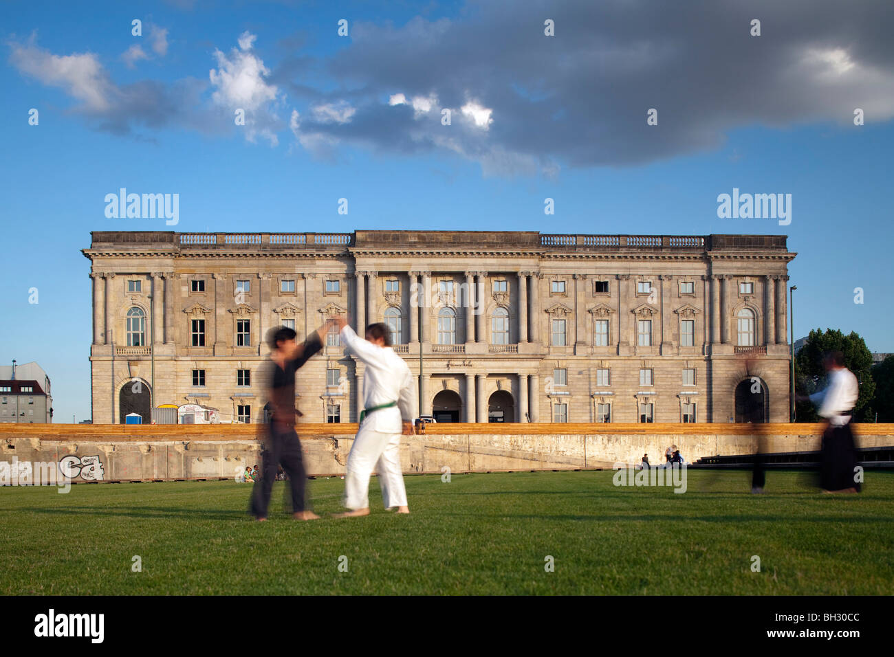 People practicing martial arts, Schlossplatz, Berlin, Germany Stock Photo
