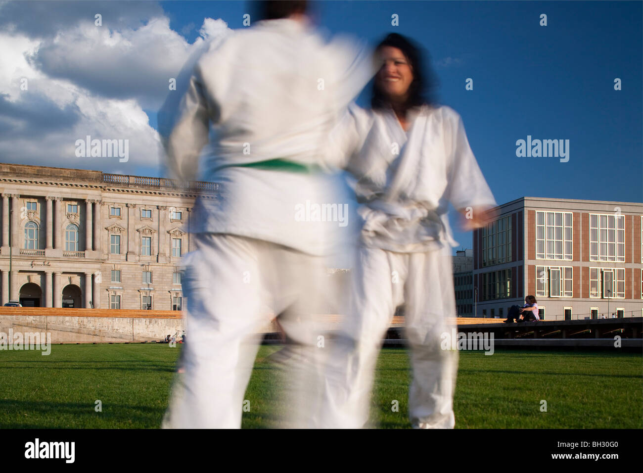 People practicing martial arts, Schlossplatz, Berlin, Germany Stock