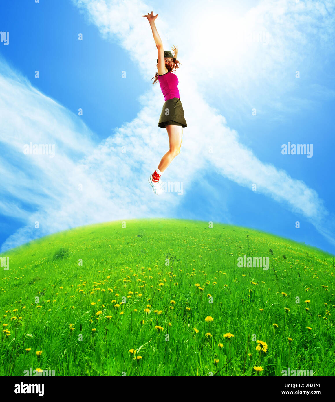 Happy jumping woman against the blue sky Stock Photo - Alamy