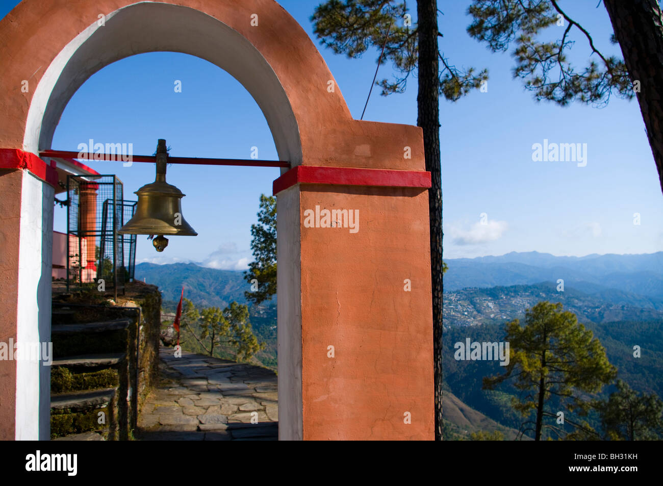 Hinu Temple entrance bell on the top of a hill near Almora in northern India Stock Photo