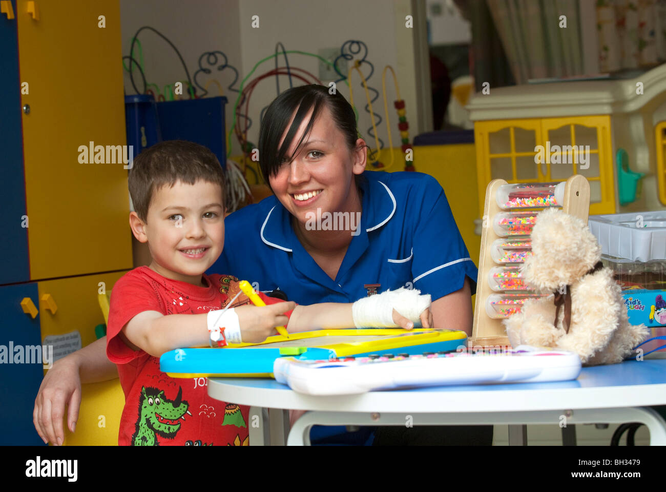 Nurse works with a young boy in Hospital Stock Photo - Alamy