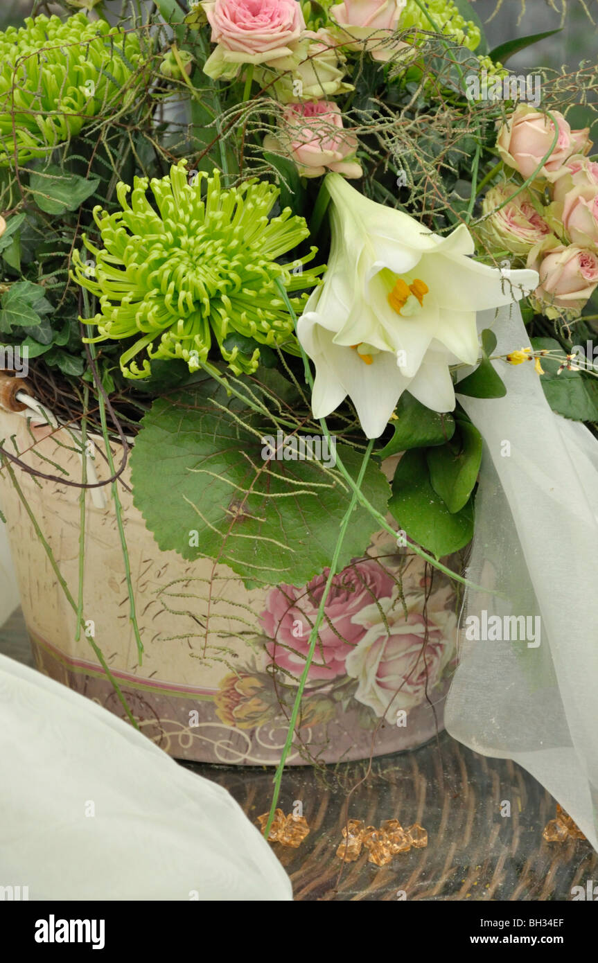 Lilies (Lilium), pincushions (Leucospermum) and roses (Rosa) Stock Photo