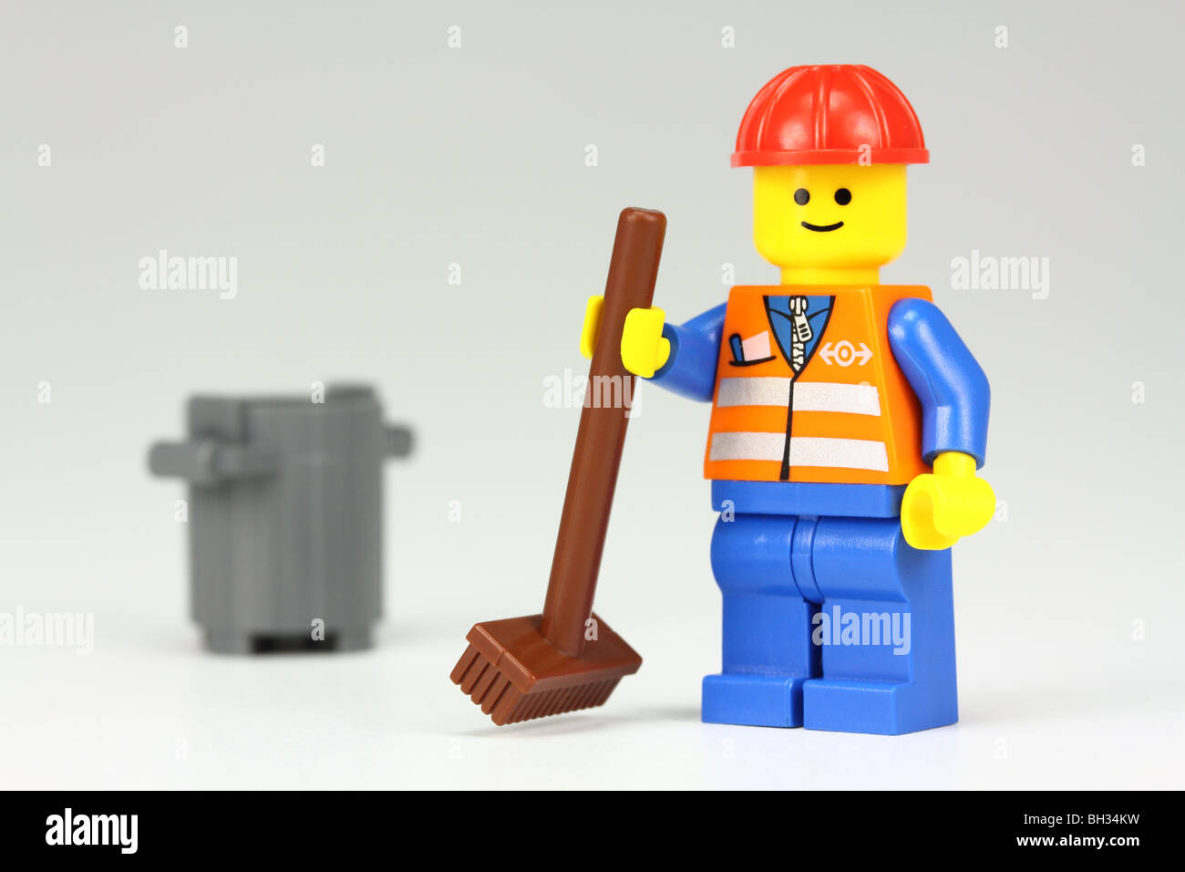 Lego janitor with brush and bin Stock Photo