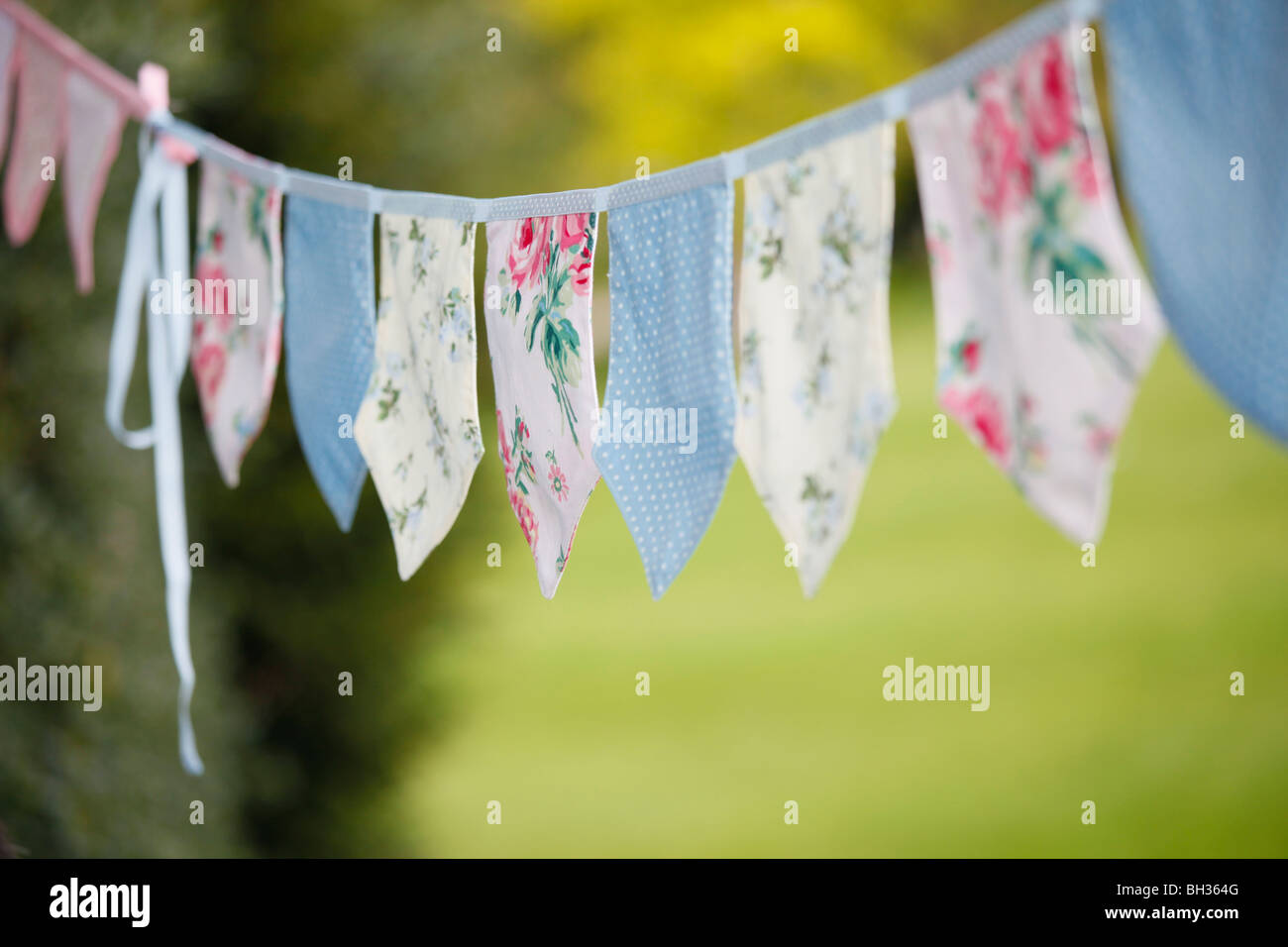 Fabric Bunting in a garden Stock Photo